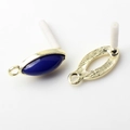 Macro detail of golden oval earring studs with blue resin inlay for DIY jewelry making - Dark Blue