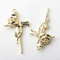 Macro detail of gold-plated rose cross alloy charms for DIY necklaces and earrings - Gold