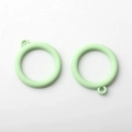 Macro shot of mint green alloy circle pendants with matte finish for DIY jewelry making - Light Green