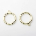 Close-up of golden alloy hollow circle charms for DIY earring and jewelry making - Gold
