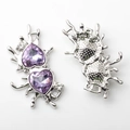 Detailed view of silver liquid metal double heart pendants with purple faceted crystals - Silver with Purple Rhinestone
