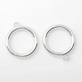 Detailed macro view of silver alloy hollow circle pendants with hanging hole for DIY crafts - Silver