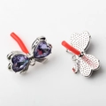 Detailed view of silver bow-knot earring components with purple heart-shaped crystals - Purple Silver