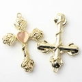 Detail of cross pendant with pink heart gemstone and embossed rose floral accents - Beige Gold