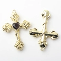 Detailed front and back view of golden alloy cross charms with rose relief and heart stone - Black Gold