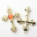 Detail view of gold alloy cross pendant with rose accents and orange heart stone for DIY - Orange Gold