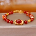 Bracelet chinois vintage en agate rouge avec centre de fleur en filigrane d'or - Style Agate Rouge