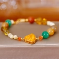 Bracelet perles multicolores style ethnique avec pendentif coeur jaune et dorure fine - Style Ambre