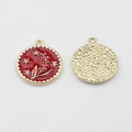 Detail of red floral enamel coin pendant with crystal accents and gold-tone textured back - Red Gold