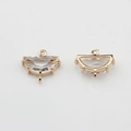 Detailed view of gold-plated semi-circle pendants with clear cubic zirconia for DIY jewelry - White