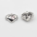 Detailed close-up view of a silver irregular heart pendant with pink gemstone and hollow back - Pink Silver