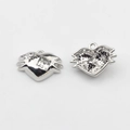 Close-up of silver heart pendants with square zircon and star rhinestone details - White-Silver