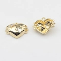 Detail of gold heart charms with central square stone and sparkling star accent - White-Gold