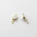 Detailed view of 3D pearl rose charms with melting drop design and gold alloy base - Gold
