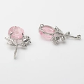 Macro detail of alloy silver rose pendants with pink resin petals and leaf accents - Pink-Silver 01