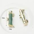 Macro shot of 30mm bamboo-shaped gold alloy pendants with green imitation jade inlay - Emerald Green Gold Medium Bamboo Pendant (WSX-1202-07)