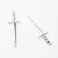 Detailed macro view of silver alloy sword pendants for DIY jewelry making - Silver