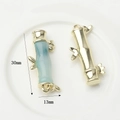 Macro view of bamboo knot jewelry pendant in gold finish with green faux jade inlay - Light Cyan Gold Medium Bamboo Pendant (WSX-1202-10)