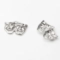 Detail view of silver comedy and tragedy mask charms with polished front and textured back - Silver