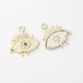 Macro view of gold devil eye pendant with clear zircons and textured back detail - Gold-White Zirconia