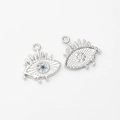 Macro detail of silver evil eye pendant with blue zircon and textured honeycomb back - Silver Blue Zircon