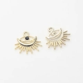 Macro view of gold evil eye pendants with black zircon and ray texture for DIY jewelry - Gold - Black Zirconia