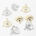 Detailed view of alloy Evil Eye charms with zircon inlay for DIY jewelry making - Random Mix