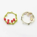 Close-up of enamel lily of the valley flower wreath pendants with golden ring detail - Red Enamel Lily Wreath / Red