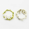 Detailed macro view of enamel lily of the valley wreath pendants for DIY jewelry making - White Enamel Lily Wreath / White