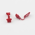 Detail of matte red star clip-on earrings featuring smooth spray-painted metal finish - Red