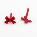 Macro detail of red matte bow alloy earring components for DIY jewelry making crafts - Red