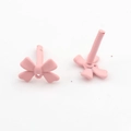 Detailed view of matte pink bow earrings with ear pins and hanging loops for DIY crafts - Pink