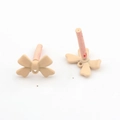 Detail of matte apricot bow charm with bottom loop for DIY earring making craft - Off White