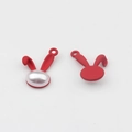 Detail of red rabbit charms with matte finish and white pearl inlay for DIY jewelry - Red