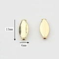 Detail of 13x6mm golden olive-shaped alloy beads with holes for DIY jewelry making - Long Oval