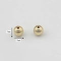 Detailed view of 7mm gold alloy textured hollow beads for DIY jewelry making - Sphere