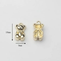 Detailed view of 18x9mm golden metal bear pendants with front and back design - Gold Panda/Bear