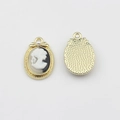 Macro view of vintage alloy cameo pendant with portrait relief and white pearl detail - Oval Lady Profile Cameo (White Background/Gold Frame) / White-Gold
