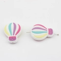 Macro shot of colorful silicone hot air balloon beads for DIY baby pacifier clips - Cool Color