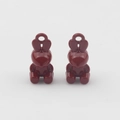 Macro view of two deep red rabbit-shaped charms with polished finish for DIY jewelry - Burgundy