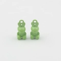 Detail view of two light green rabbit-shaped alloy charms for DIY jewelry making - Green