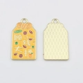 Detail of yellow enamel alloy charms with RICH text and coin motifs for DIY jewelry - Fortune and Good Luck