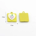 Detailed view of yellow square DIY pendants with white heart and purple grape design - Purple Grape (Yellow Square)