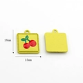 Detail of yellow enamel cherry pendants showing 18x15mm dimensions and textured back - Double Cherry (Yellow Square)