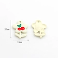 Detailed macro view of cream flower charm with cherry pattern for DIY jewelry - Cherry (Cream Flower Shape)