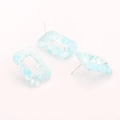 Close-up of geometric resin rectangle earrings with blue flake inclusions and silver pins - Sky Blue