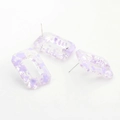 Macro detail of rectangle resin earrings with purple ink spots and silver metal studs - Purple