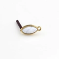 Macro view of gold vintage marquise resin stone pendant with hanging ring for DIY jewelry - Marble White