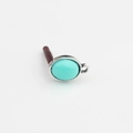Macro detail of oval turquoise resin pendant with silver metal edge for DIY earrings - Sky Blue & Silver