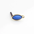 Macro detail of vintage blue resin marquise pendant with textured gold metal frame - Dark Blue